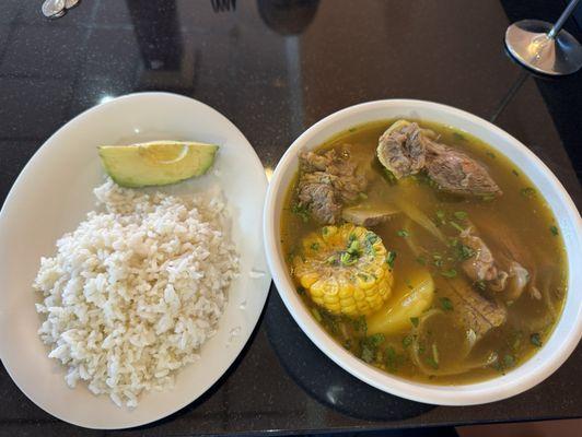 Beef soup with white rice and avocado