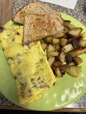 Greek omelette with homefries and rye toast.