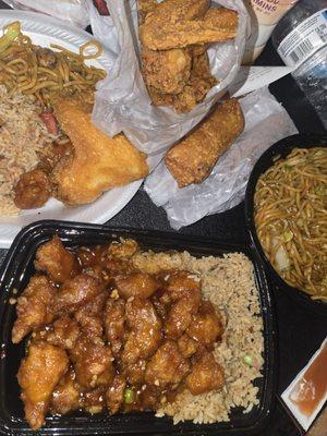 General tsos chicken, cheesesteak egg rolls, Veggie lo mein, and chicken wings