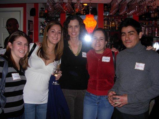 Native Spanish speakers and Spanish fanatics exchanging languages and cultures at a local bar in Washington DC.