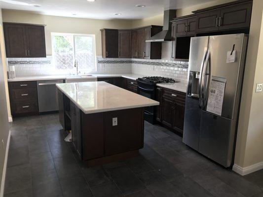 Extend kitchen approx 8' and complete remodeling, including new flooring, cabinets and counter top.