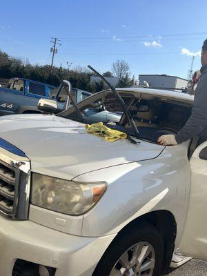 Cleaning off remaining dust and glass, before adding the windshield adhesive.