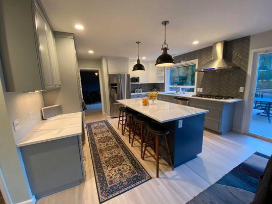 Kitchen after painted in three colors, white, gray, and blue