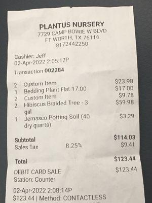 Receipt for a flat of impatiens, two pots, two saucers,  two plants, and a bag of soil.