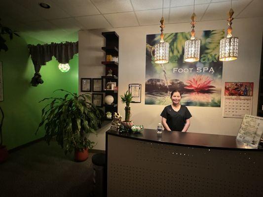 Front desk/entrance with my massage therapist, Tina.