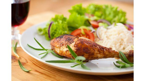 Chicken, rice, plantains, and salad