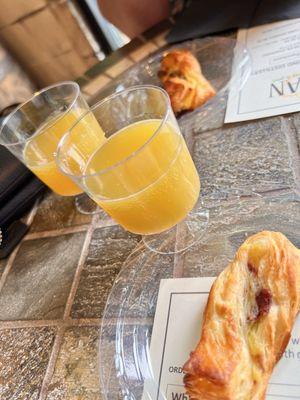 Breakfast croissant and mimosa