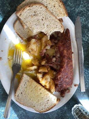 Corned beef hash, two eggs, delicious wheat toast, breakfast potatoes