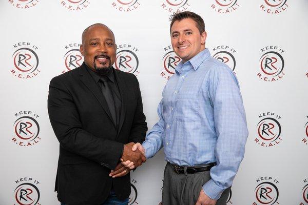 911 IT CEO Adam Spencer, with Daymond John, from the Shark Tank