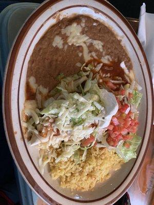 Burrito lunch special with refried beans, Mexican rice and greens