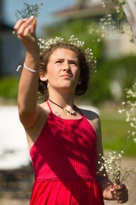 Flower girl helping to decorate for a wedding in Wiscassett, Maine.