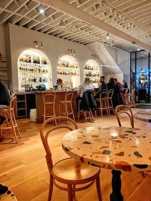 Interior downstairs dining space - lots of wood and terrazzo