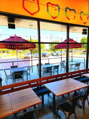 Looking out at shaded patio tables.