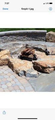 Stone wall with pavers and rock fire pit