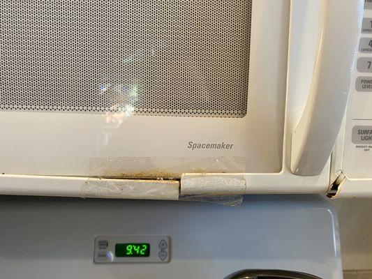 Broken and dingy microwave