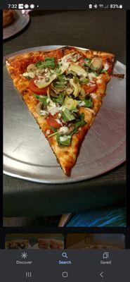 Slice of delicious Tree Hugger Veggie Pizza. Very generous slices!