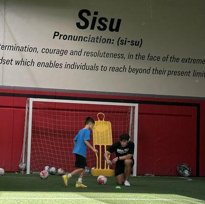 Coach CJ and Henry working on ball contact