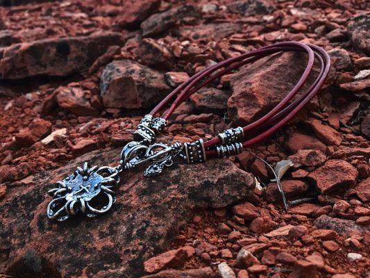 Black sterling silver with red leather cord