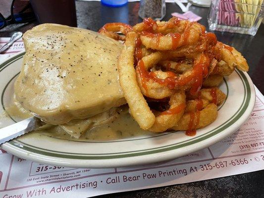 Gravy covered turkey sandwich