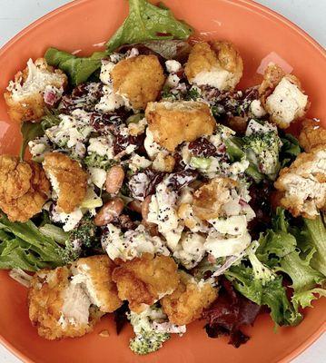 Broccoli Salad- with broccoli  cauliflower, cherries, apple, beans, goat cheese and a poppyseed dressing topped with crispy chicken