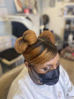 Bun updo, colored hair on natural hair.