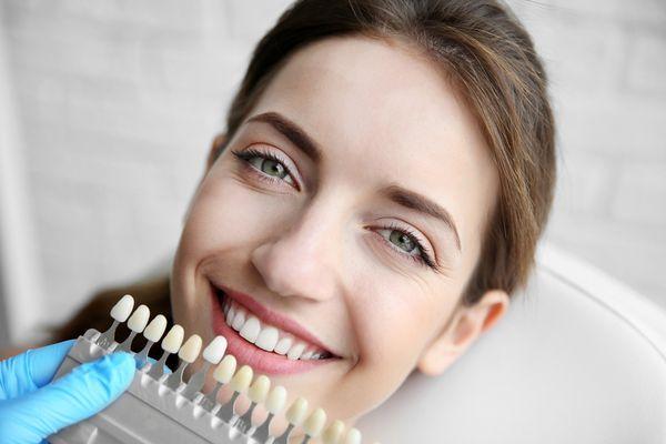 A dental veneer is a thin laminate made of durable, tooth shaped porcelain which is custom made (for shape and color) by a de...