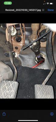 Power cable being ran through the steering linkage.  Not secured at all.