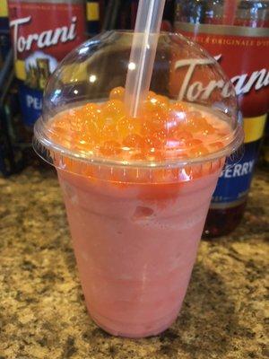 Strawberry brain freeze with passion fruit boba