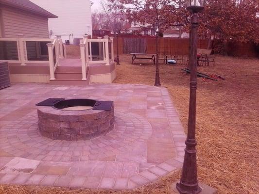 newly installed paver patio with fire pit and solar lamps!!  thank you medallion!!