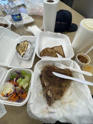 Salad, baked potato with mystery seasoning, soggy bread, T-Bone, and beans