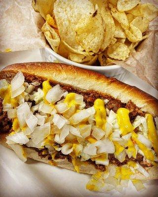 Junkyard Dog is loaded with West Virgin style Chili, Chopped White Onions, House made Slaw and Yellow Mustard