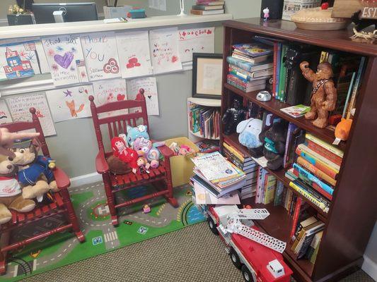 Toys and books for kids of visitors and clients. Shows what the office values.