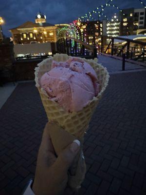 A scoop of fresh strawberry  in homemade waffle cone yummm