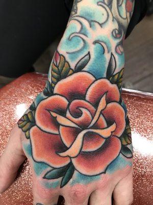 Freehand rose on the hand