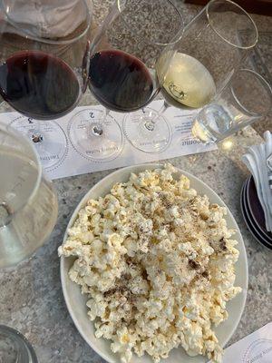 Happy hour wine flight and popcorn