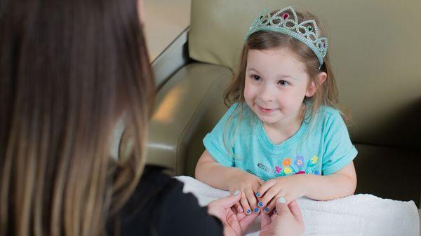 One of our special guests enjoying her Princess Manicure!