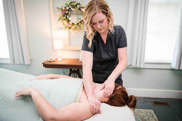 Brandi working on the clients neck and shoulders