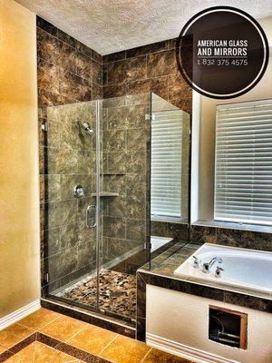 Frameless Master Glass Enclosure with a 28" wide door, Inline Notch panel and return panel, all to a height of 80" from the top of the curb