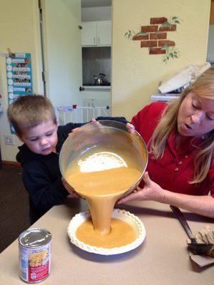 Kathy helping my son make pumpkin pies to take home for Thanksgiving.