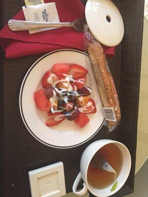 Fresh fruit, choc dipped biscotti and herbal tea.