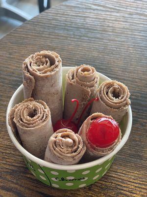 Chocolate ice cream with peanut butter and cherries.