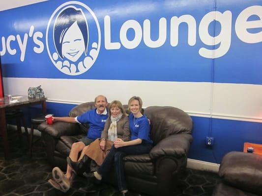 Jennifer (owner) relaxes in Lucy's Lounge on one of the leather couches.