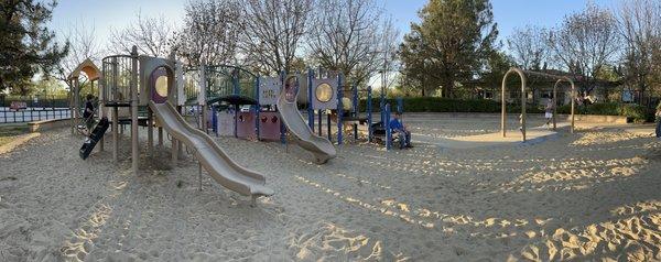 Playground with sand and swing set for big kids