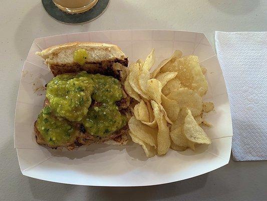 Seasoned chicken with cucumber mango salsa on Hawaiian roll with chips