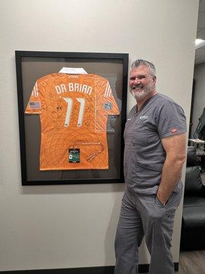 Dr. Brian with his 2011 Houston Dynamo jersey. We are the treating chiropractors for the Dynamo and the Dash!