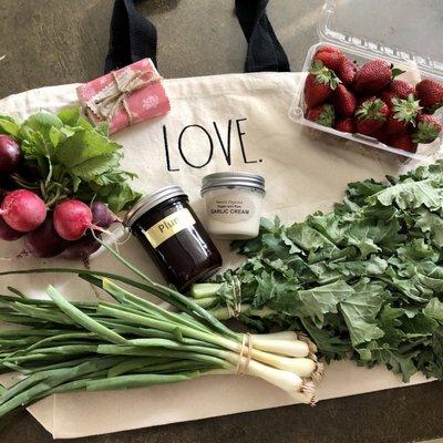 A variety of produce picked up from different vendors along with homemade artisan soap and some homemade plum jam and garlic cream