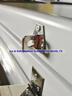 These are hasps, not the "locking bar" Alamo Refrig claims they have. Thank you Ice & Refrig for the photos.