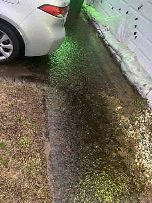 This is what I had to deal with every time it rains. I had to put down sandbags to prevent my garage from flooding.