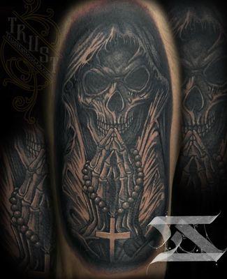 Black and grey skull tattoo