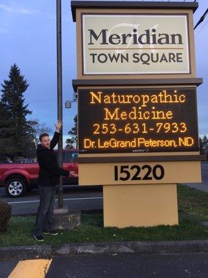 Dr LeGrand Peterson excited to see his name on a billboard!